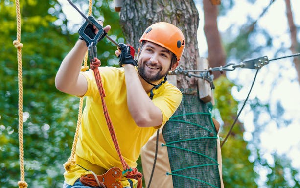 Man enjoying a zipline adventure at Montes de Laboreiro.