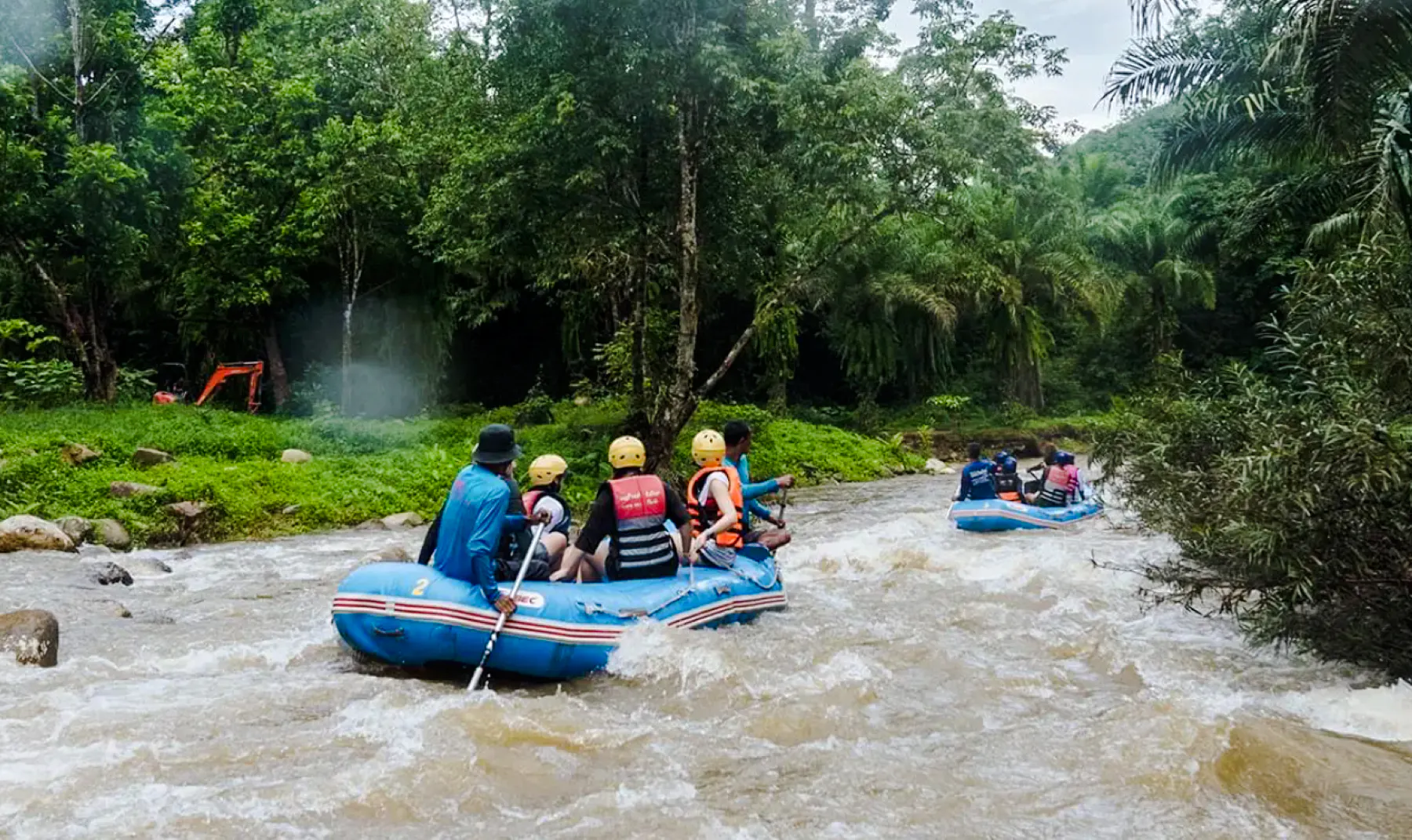 White water rafting adventure in Krabi's lush jungle setting.