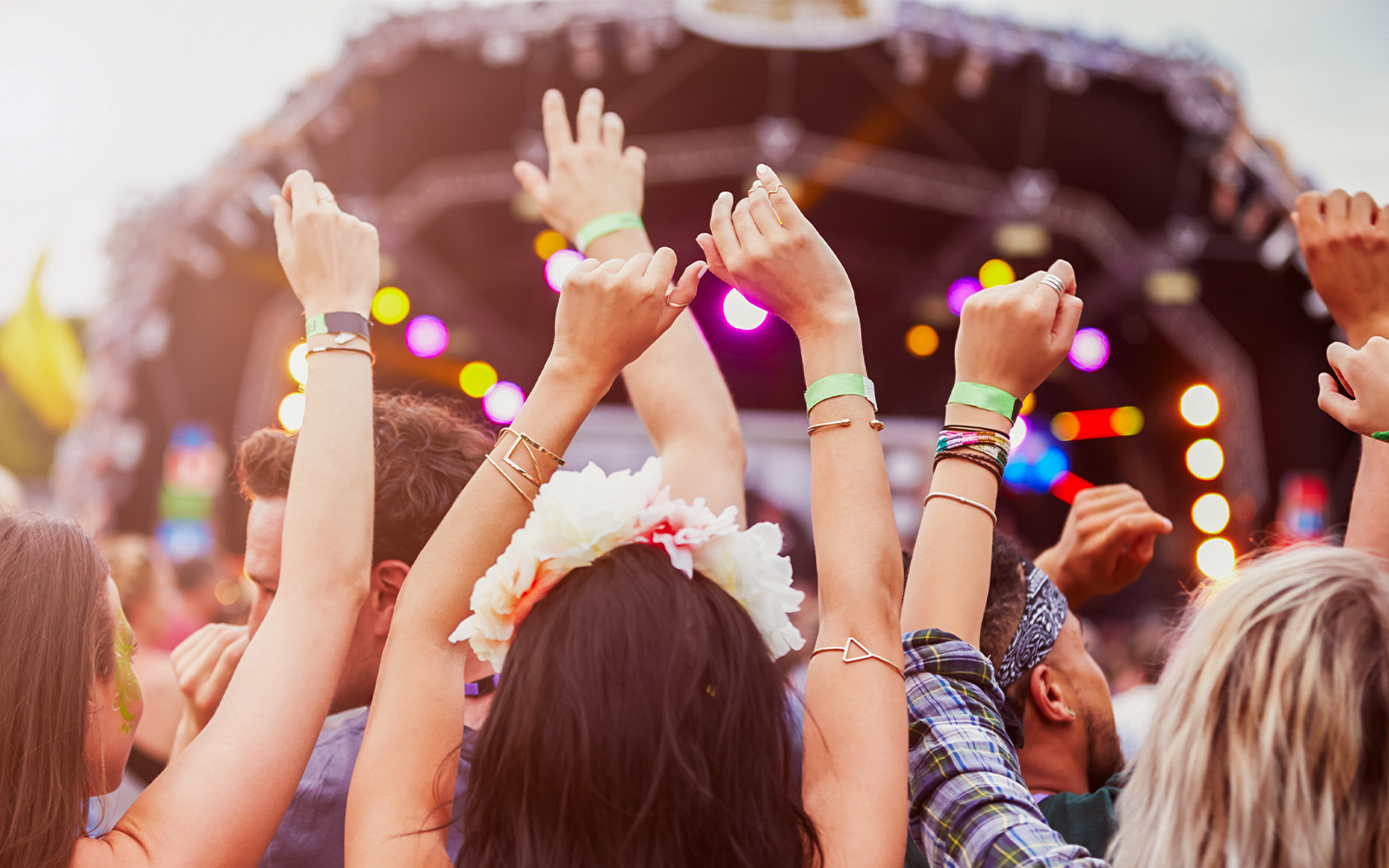 Audience with hands in the air at a music festival