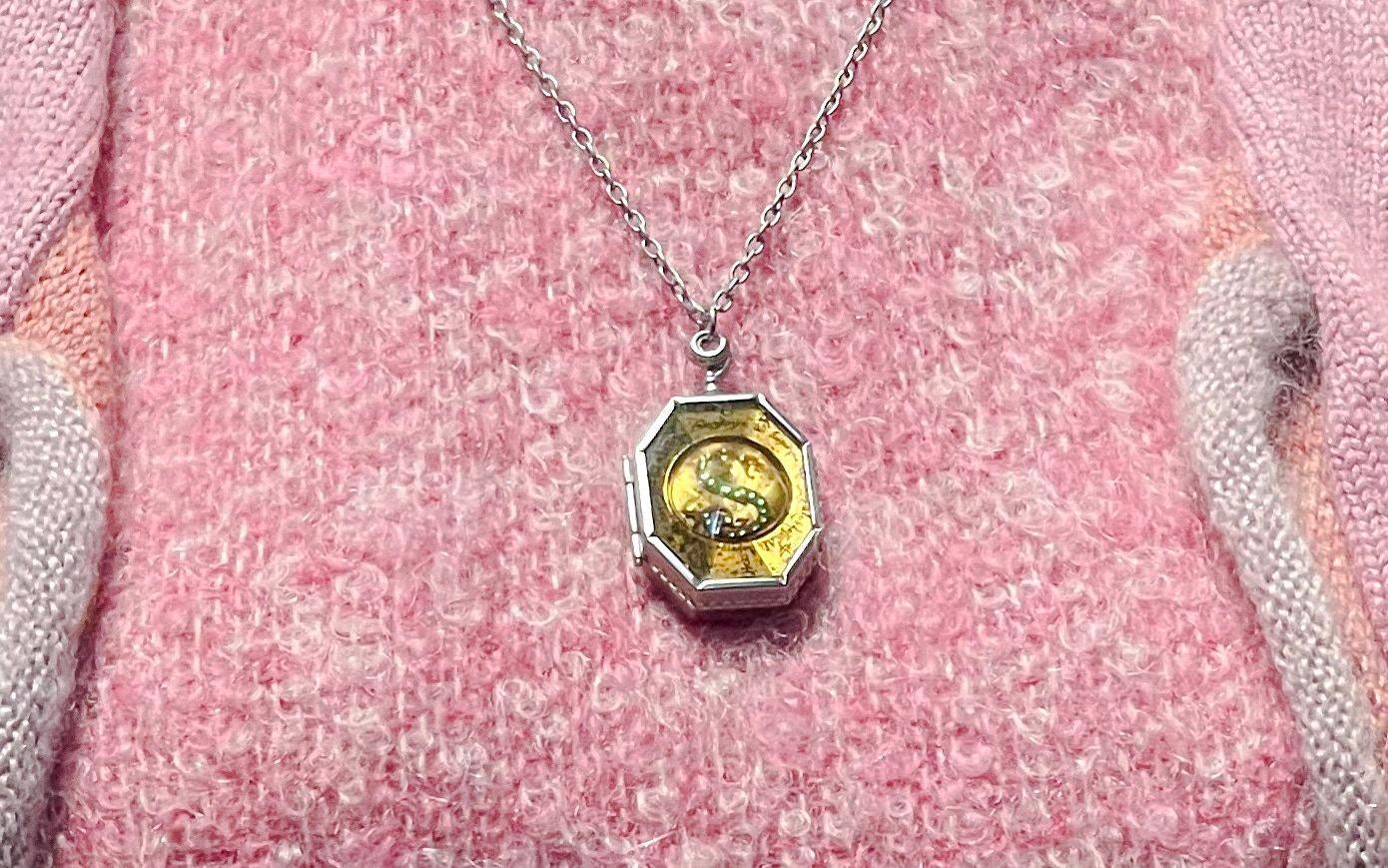 Locket necklace resembling Slytherin's locket from Harry Potter series.