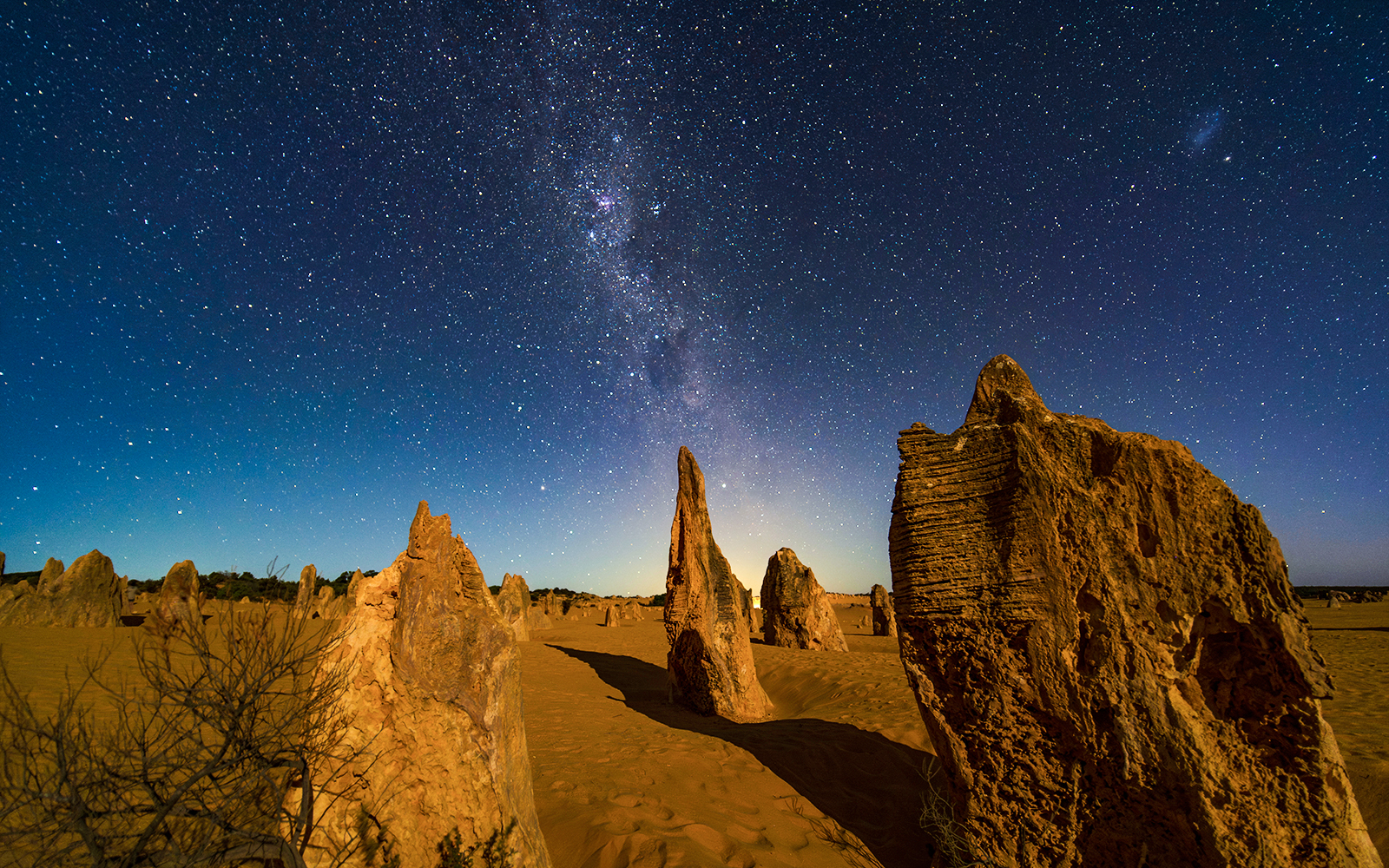 Rock formations under a starry night sky at Pinnacles Desert, Australia.