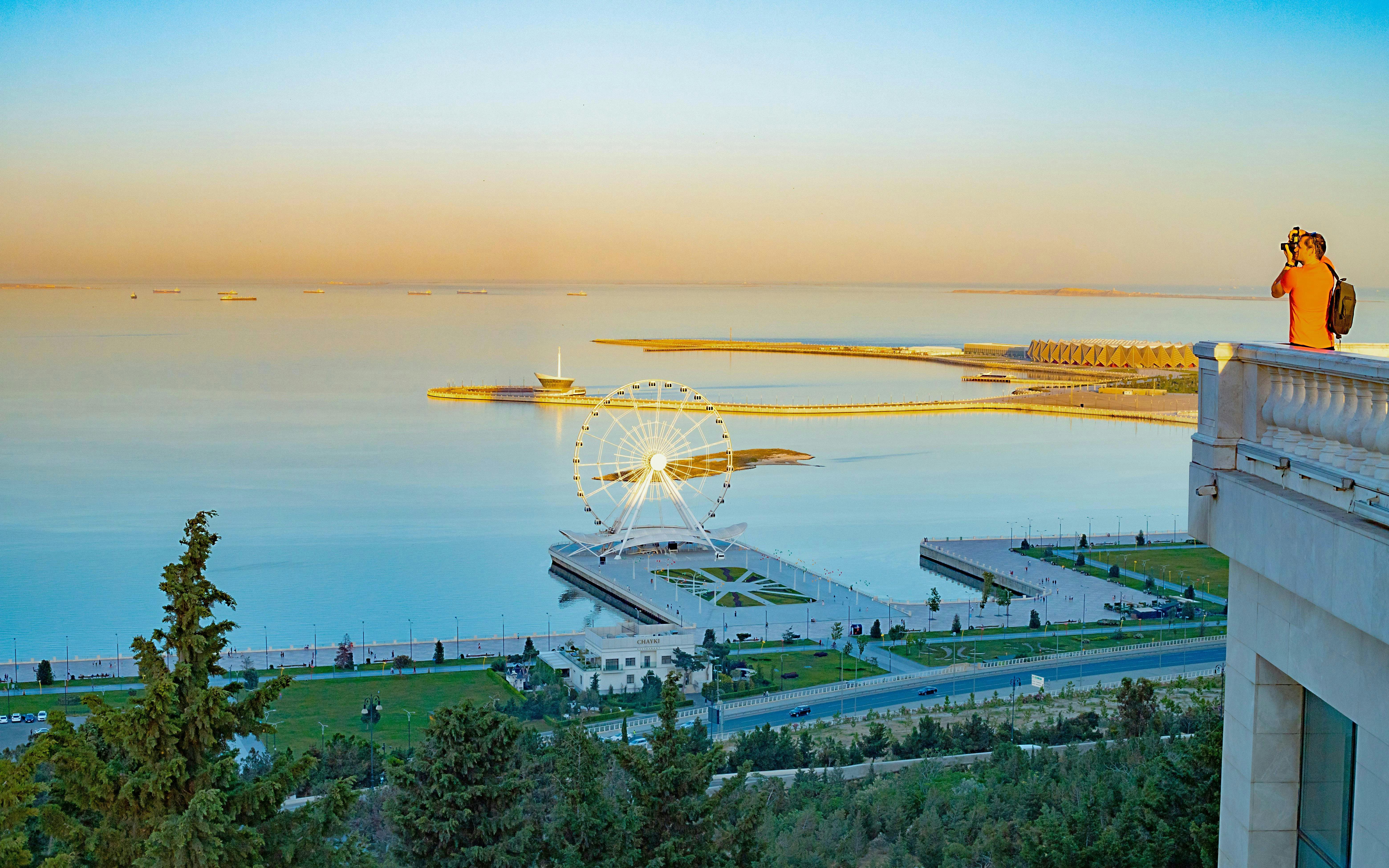 Baku city seaside view from Highland Park with Ferris wheel and promenade.