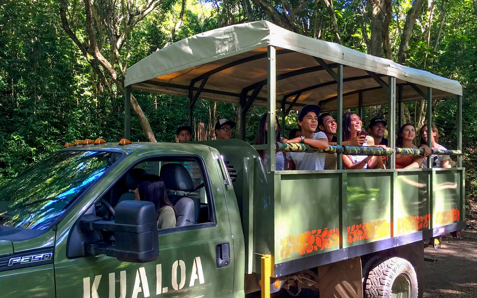 Traverse the bumpy roads in a custom open-air safari vehicle