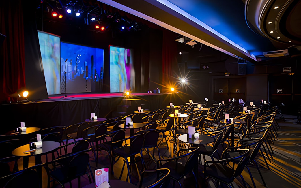 Teatro Flamenco Madrid stage set for Emotions Show with seating and colorful lights.