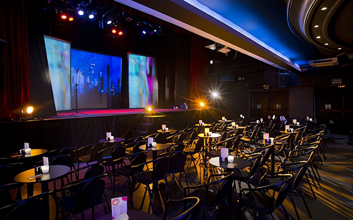 Teatro Flamenco Madrid stage set for Emotions Show with seating and colorful lights.