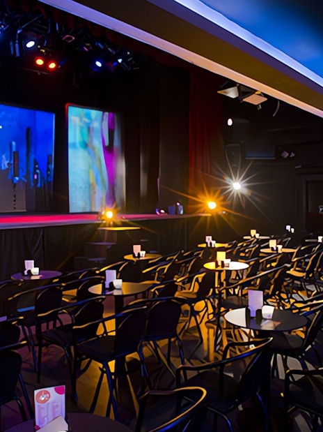 Teatro Flamenco Madrid stage set for Emotions Show with seating and colorful lights.
