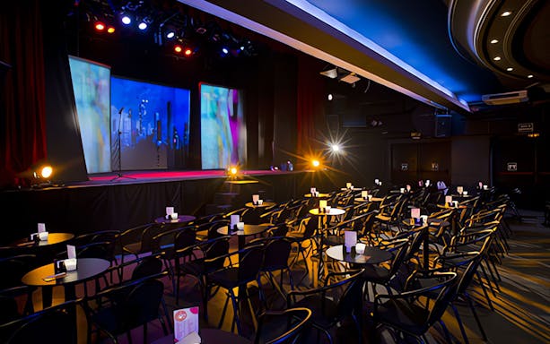 Teatro Flamenco Madrid stage set for Emotions Show with seating and colorful lights.