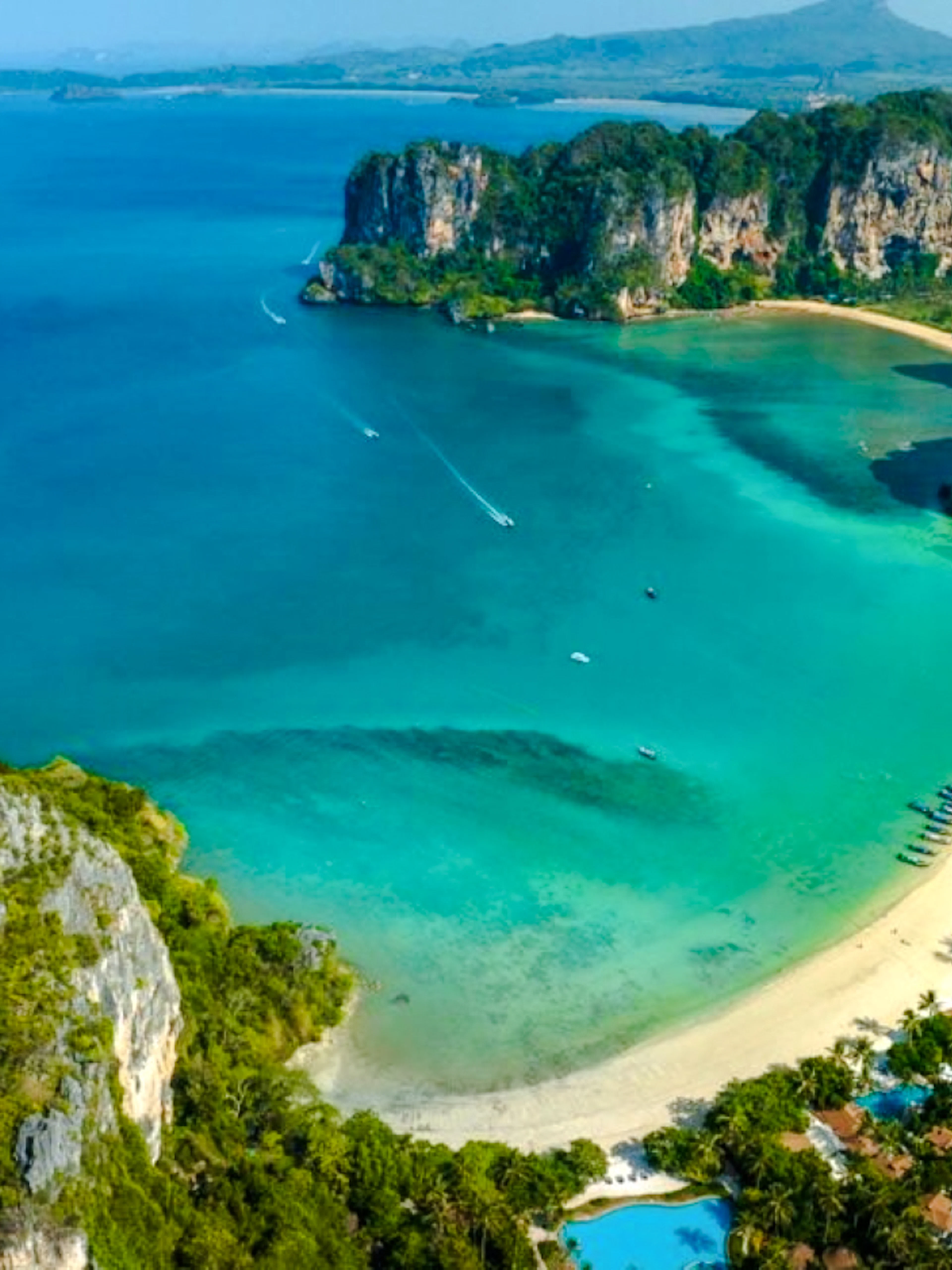 Rock formations and turquoise waters at Railay Beach, Krabi, ideal for half-day rock climbing.