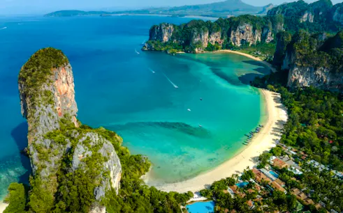 Rock formations and turquoise waters at Railay Beach, Krabi, ideal for half-day rock climbing.