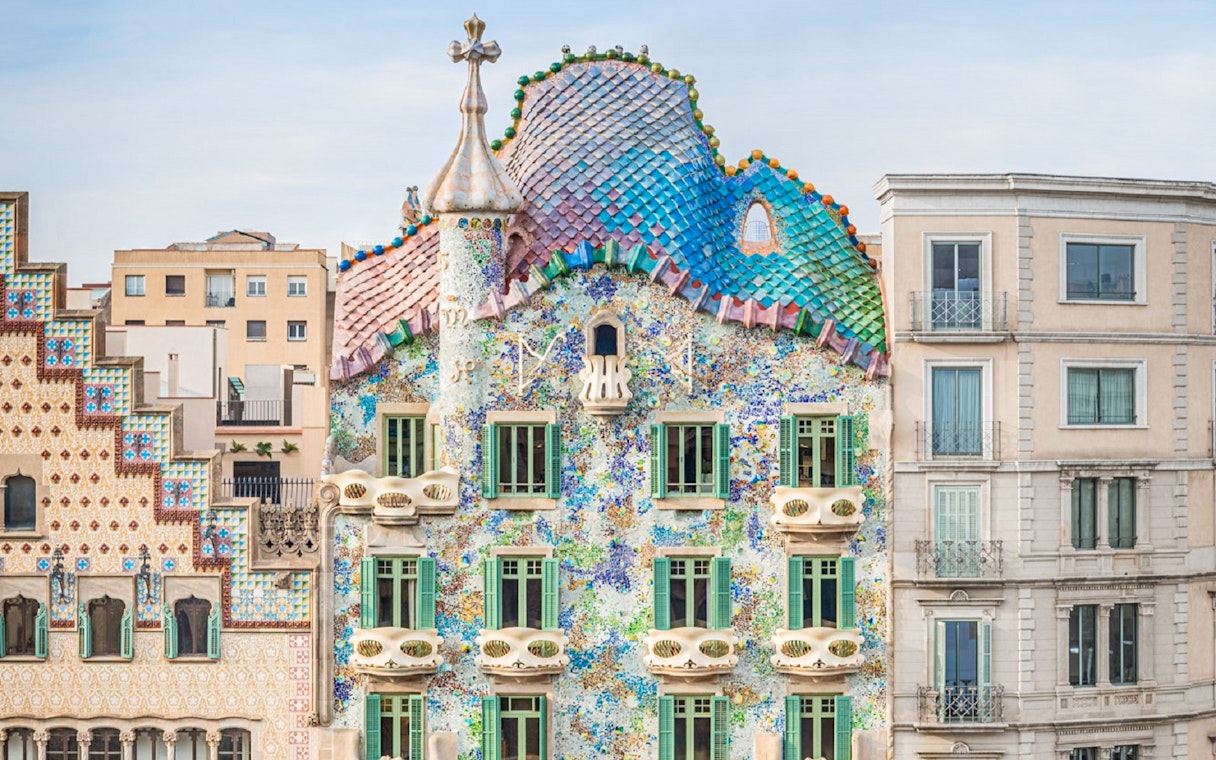 Casa Batlló facade with colorful mosaic tiles in Barcelona.