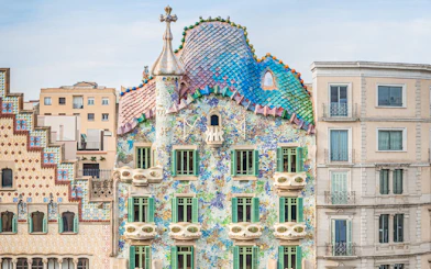Casa Batlló facade with colorful mosaic tiles in Barcelona.