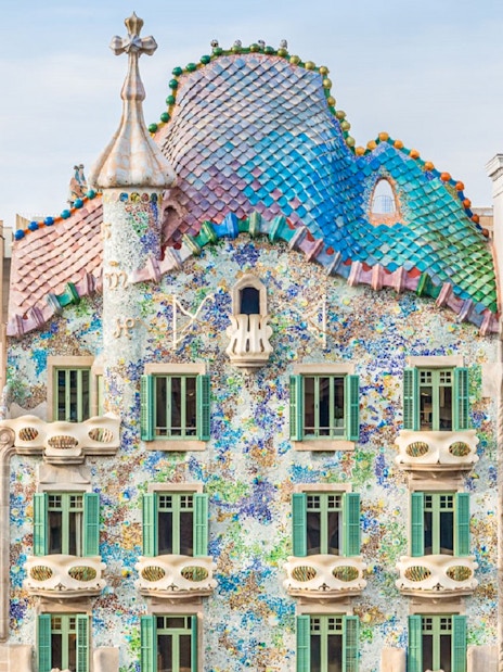 Casa Batlló facade with colorful mosaic tiles in Barcelona.