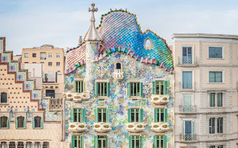 Casa Batlló facade with colorful mosaic tiles in Barcelona.