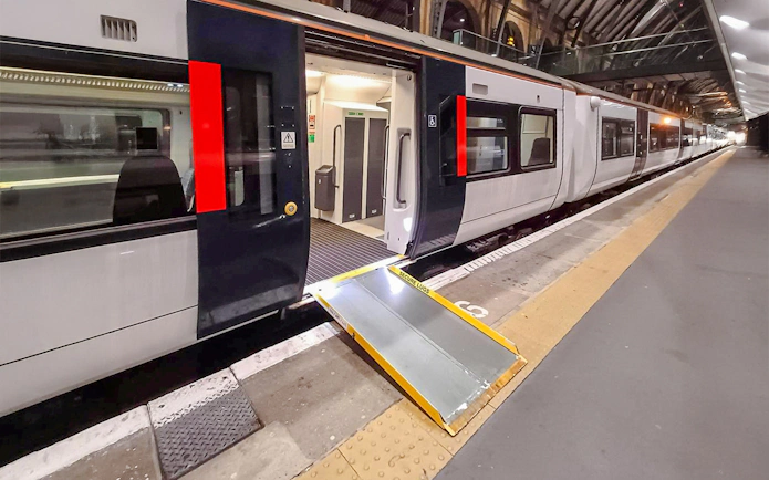 Train at platform with accessibility ramp, London St Pancras International.