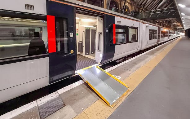 Train at platform with accessibility ramp, London St Pancras International.