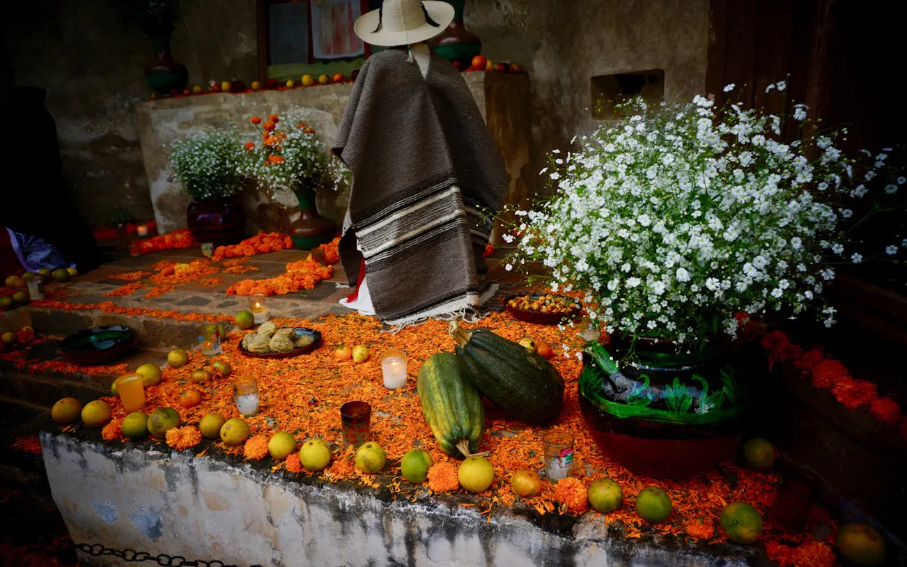 Mixquic Day of the Dead altar with marigolds, candles, and traditional offerings.