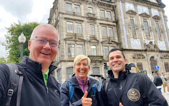 Group on walking tour near Livraria Lello, Porto.