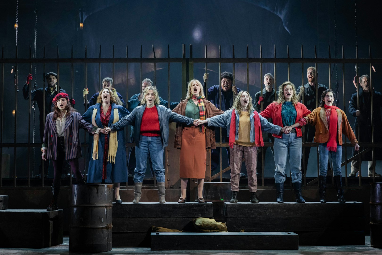 Stage performance of "The Last Ship" in Brisbane with actors singing in unison.