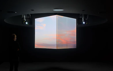 Interactive digital display inside Glories Skyline Tower showing sunset visuals.