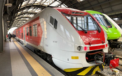Malpensa Express train at Milan station platform.