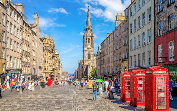 Royal Mile Edinburgh with St. Giles' Cathedral and red phone booths.