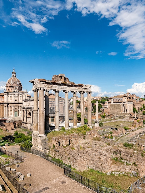 Tourists exploring ruins of Palatine Hill and Roman Forum, Rome, Italy.