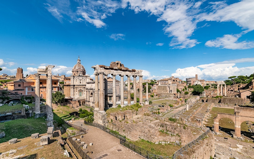 Tourists exploring ruins of Palatine Hill and Roman Forum, Rome, Italy.