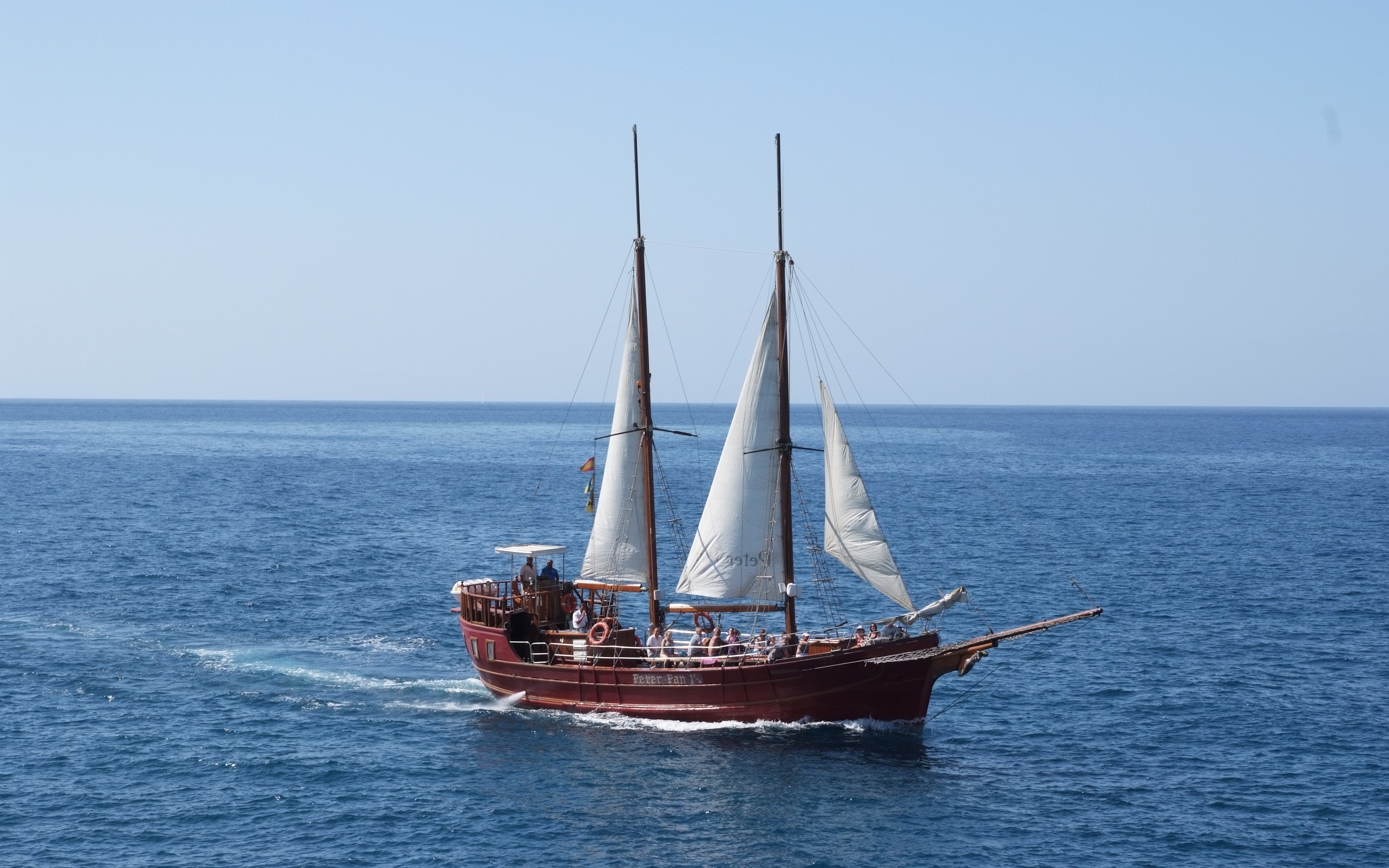 Tourists on Peter Pan Pirate boat sailing in Tenerife for whale and dolphin watching.