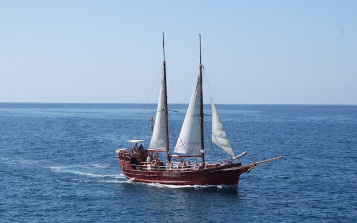 Tourists on Peter Pan Pirate boat sailing in Tenerife for whale and dolphin watching.