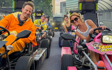 Go-kart riders in costumes enjoying Shibuya Crossing 75-min experience by Monkey Kart in Tokyo.
