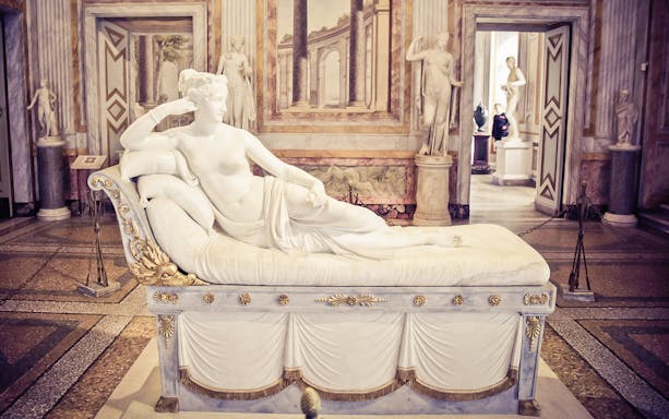 Sculpture of reclining figure in Borghese Gallery, Rome, during half-day tour.