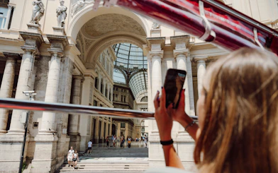 Sightseeing from a bus in Naples, capturing Galleria Umberto I's architecture.