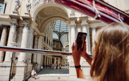Sightseeing from a bus in Naples, capturing Galleria Umberto I's architecture.