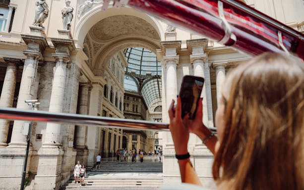 Sightseeing from a bus in Naples, capturing Galleria Umberto I's architecture.