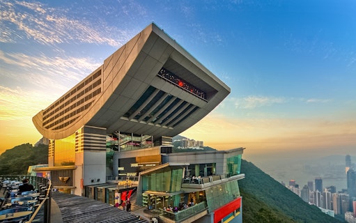 Sky Terrace 428 at sunset, overlooking Hong Kong skyline and Victoria Peak.