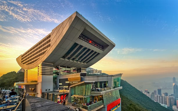 Sky Terrace 428 at sunset, overlooking Hong Kong skyline and Victoria Peak.