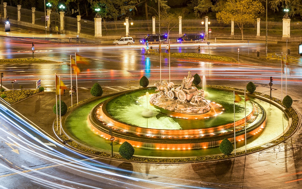 Cibeles Fountain illuminated at night with light trails, Madrid.