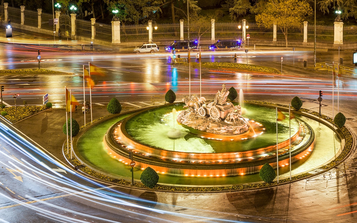 Cibeles Fountain illuminated at night with light trails, Madrid.