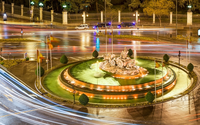 Cibeles Fountain illuminated at night with light trails, Madrid.