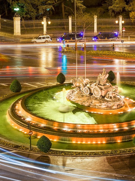 Cibeles Fountain illuminated at night with light trails, Madrid.
