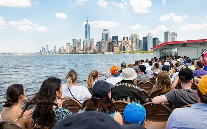 Guests on Liberty Super Express viewing New York City skyline.