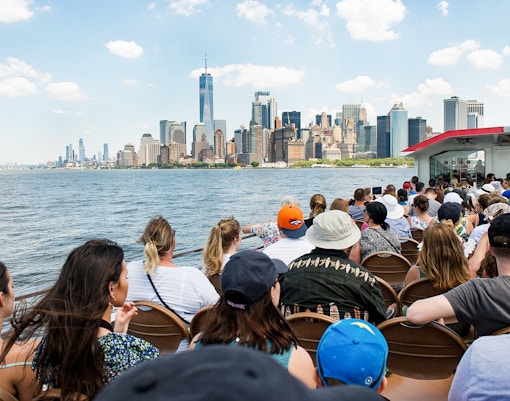 Guests on Liberty Super Express viewing New York City skyline.
