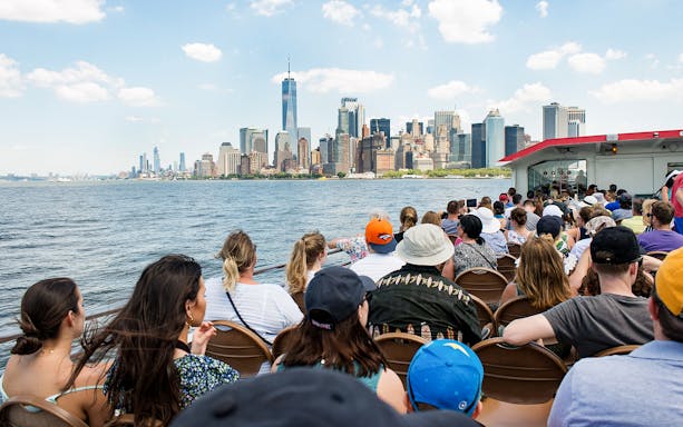 Guests on Liberty Super Express viewing New York City skyline.