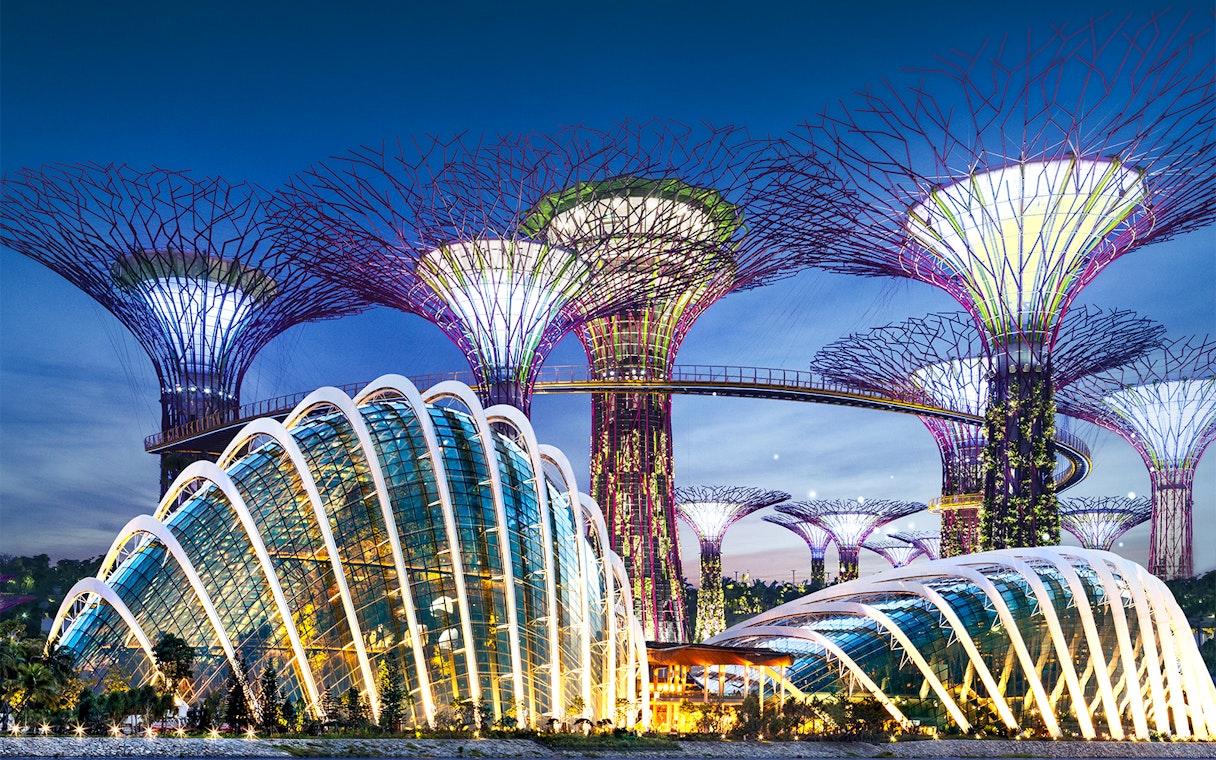 Gardens by the Bay Supertree Grove and Flower Dome in Singapore at dusk.