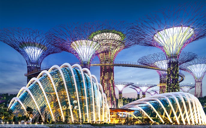 Gardens by the Bay Supertree Grove and Flower Dome in Singapore at dusk.