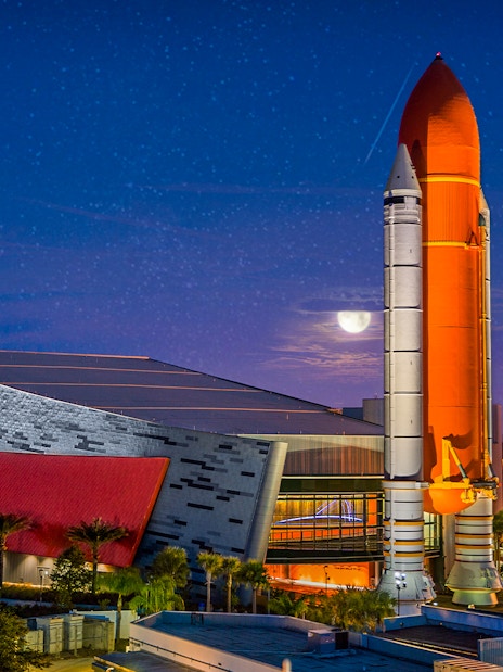 Kennedy Space Center rocket display at night, Orlando Explorer Pass.