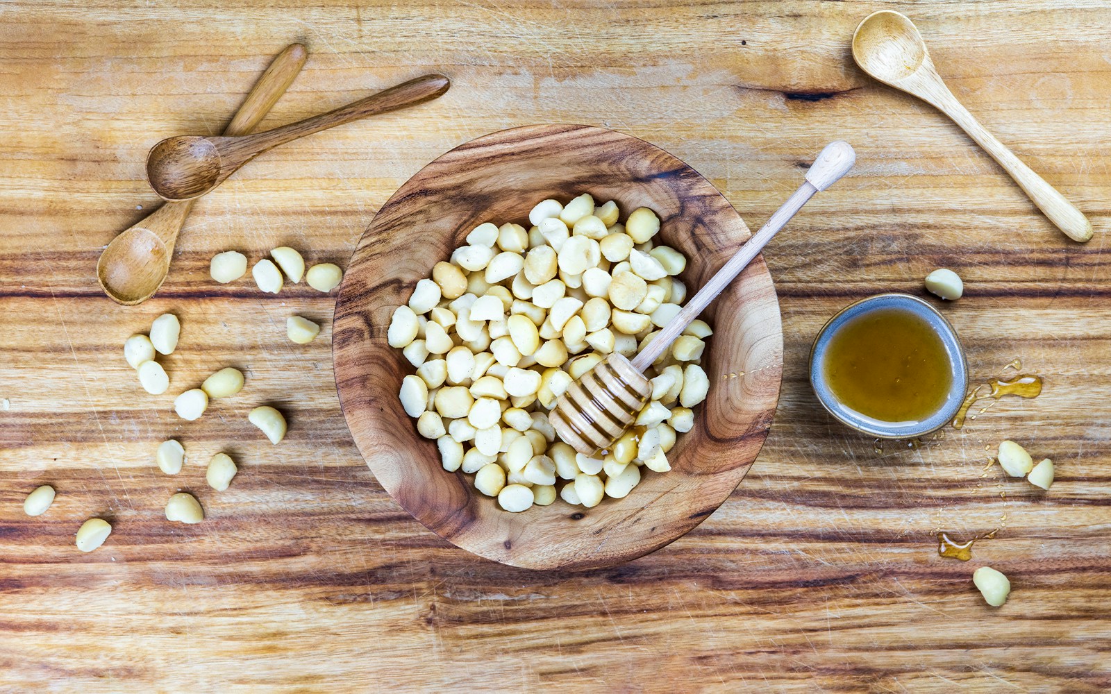macadamia and honey being prepared as a sweet treat.