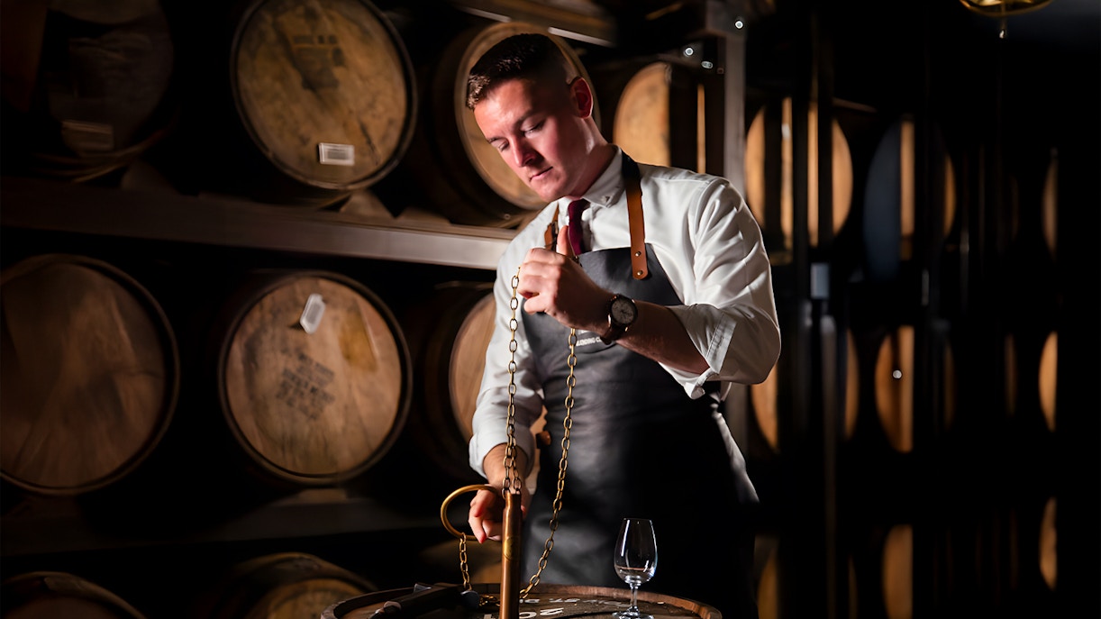 Jameson Distillery Black Barrel Blending Class participants blending whiskey in Dublin distillery.