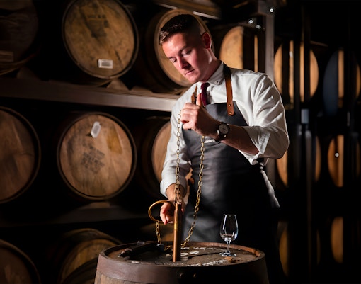 Jameson Distillery Black Barrel Blending Class participants blending whiskey in Dublin distillery.