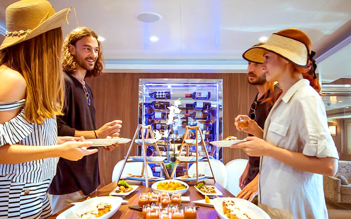 Guests enjoying a buffet on Athens Day Cruise.